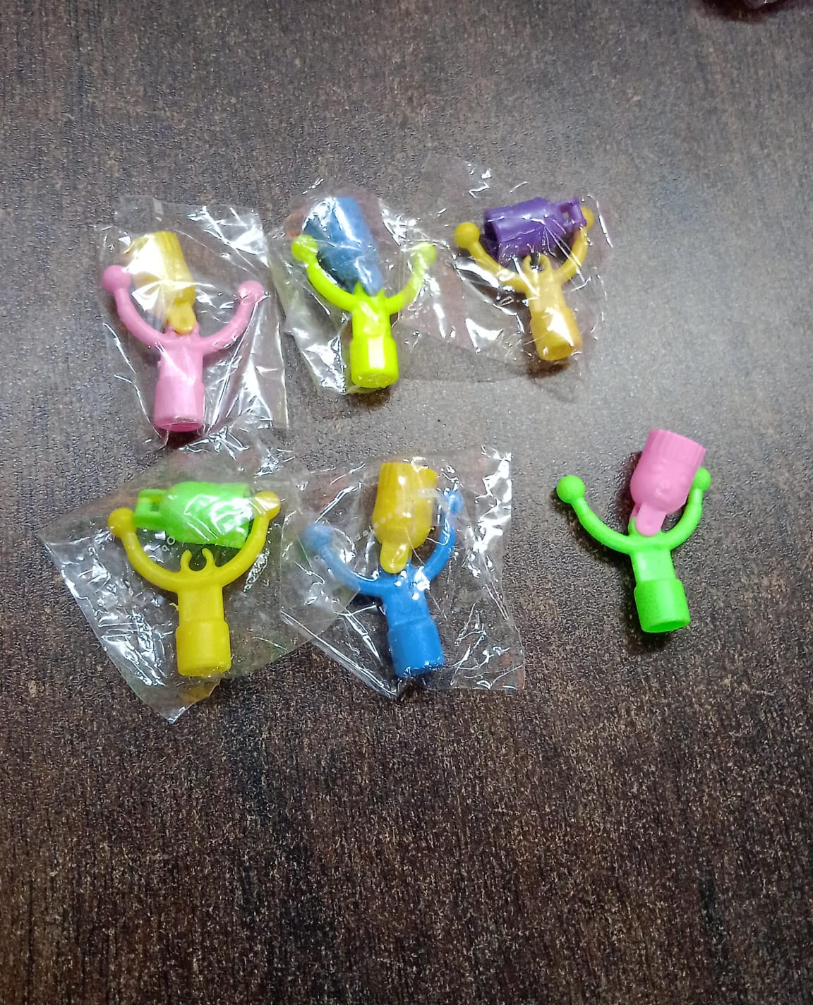 Bell shape pencil top toy by Wukusy, colorful and decorative accessory for pencils, designed as a fun promotional toy in mixed colors.