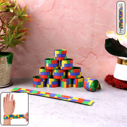 Set of 12 colorful Snap Slap bracelets by Wukusy, flexible plastic toy wristbands with snap closures in bright, vibrant colors.
