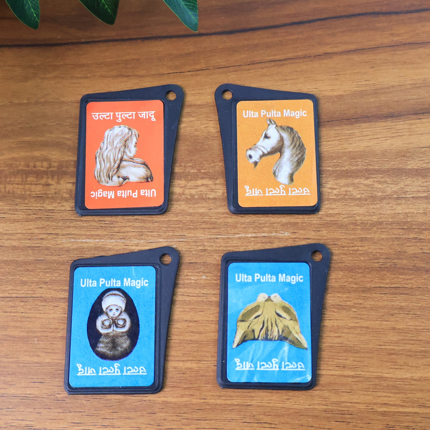 Wukusy Flip Image Ulta Pulta Magic Card Toy showing colorful flipping card in a child's hand.