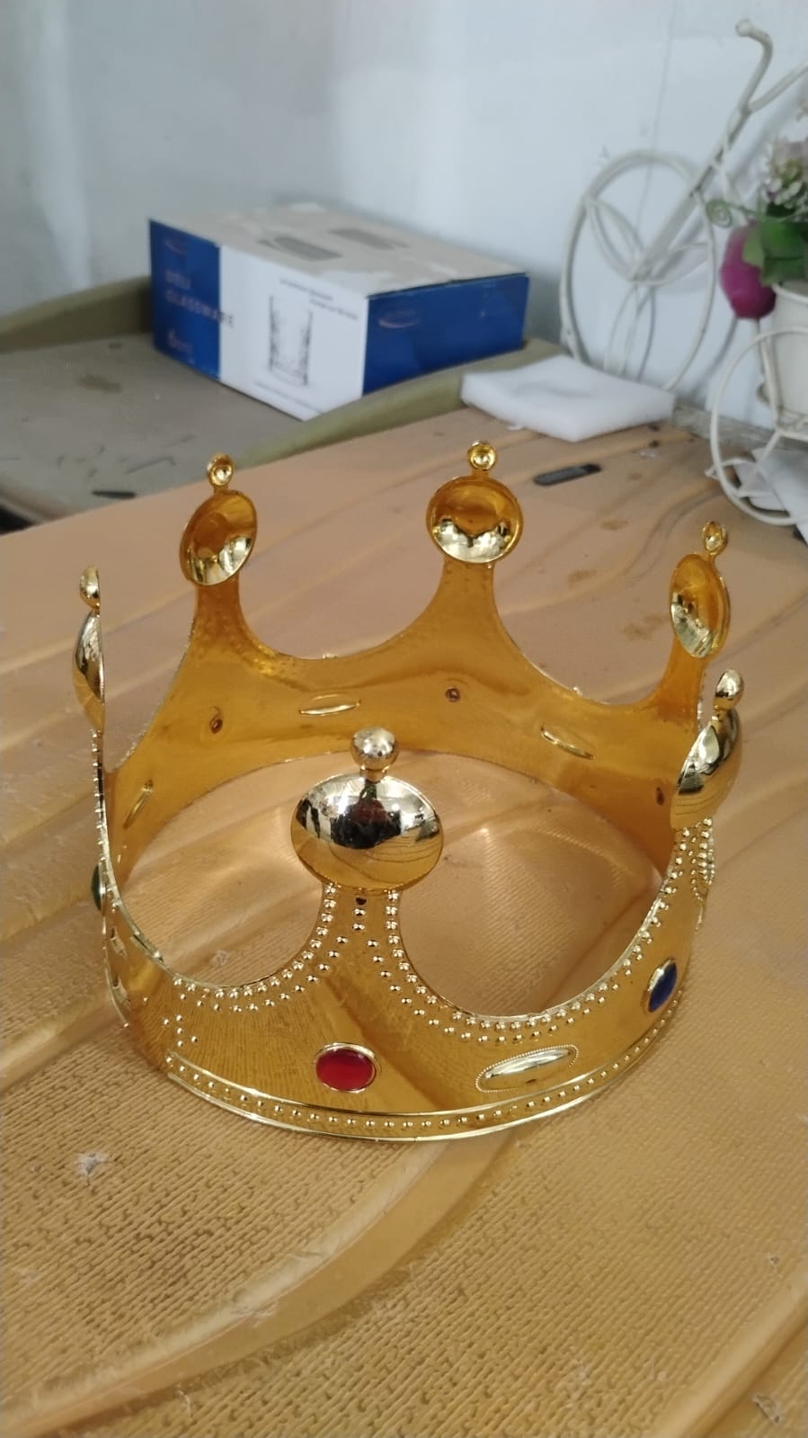 Wukusy toy golden royal crown with colorful gems, featuring a detailed design and vibrant jewel accents.