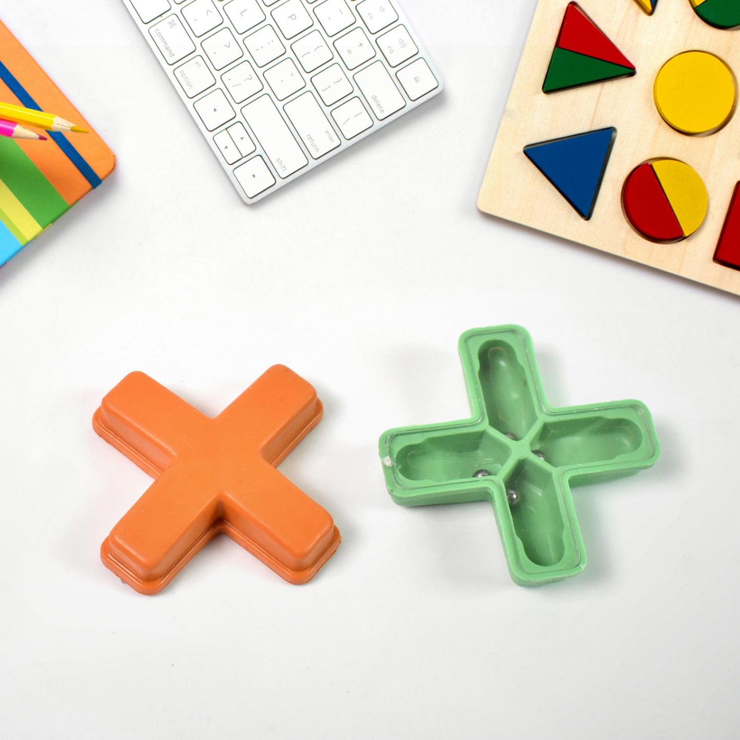 Wukusy Magic Toys Magic Cross puzzle in mixed colors, a fun magic trick toy for children with a colorful design.