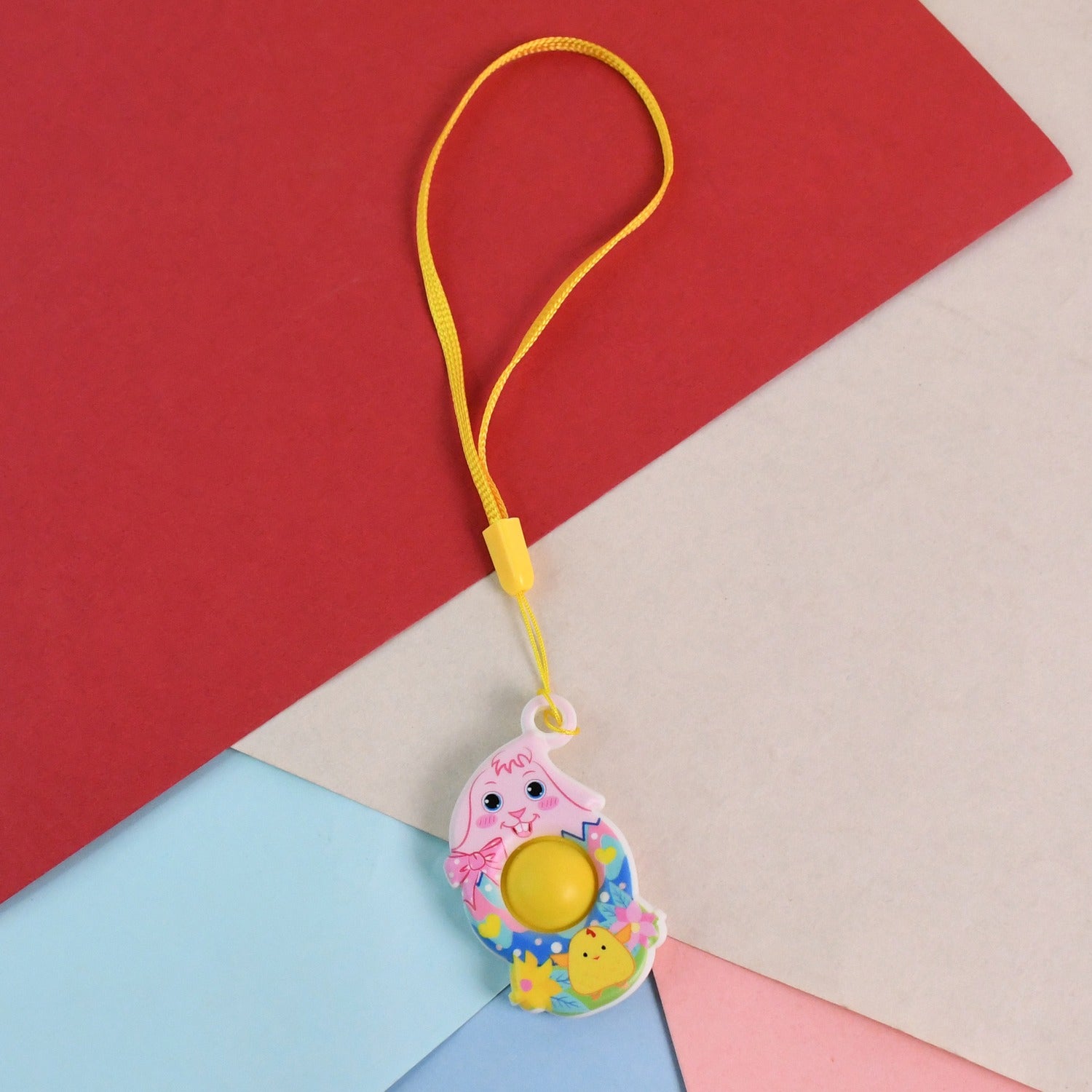 Wukusy mini cartoon chick-shaped push pop fidget toy with hanging strap, colorful and squeezable for stress relief and play.