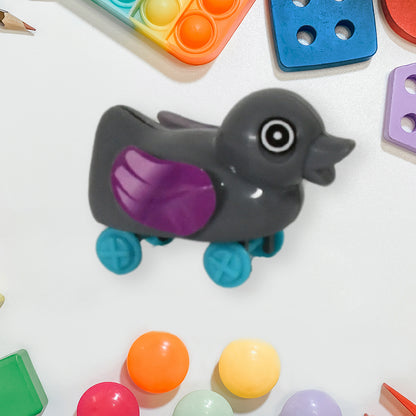 Small push-back duck toy by Wukusy featuring an ejectable spring tail, perfect for DIY fun and interactive play.
