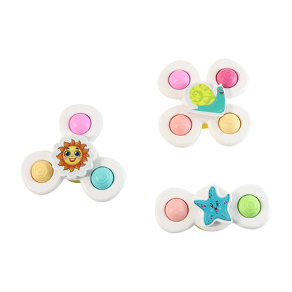 White Wukusy baby spinner toy set with three sensory suction spin toys for infants, featuring colorful, engaging designs.
