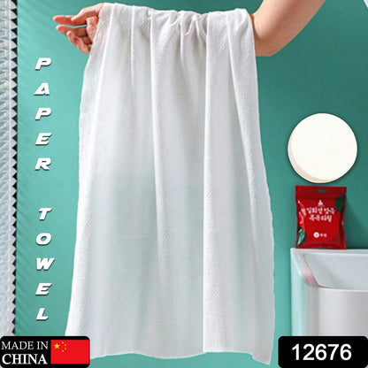 Wukusy compressed cotton towel for travel, camping, and outdoor use, showing a compact, portable disposable tissue towel.