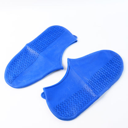 Pair of blue Wukusy waterproof silicone rain boot covers with non-slip soles, foldable and reusable for travel protection.