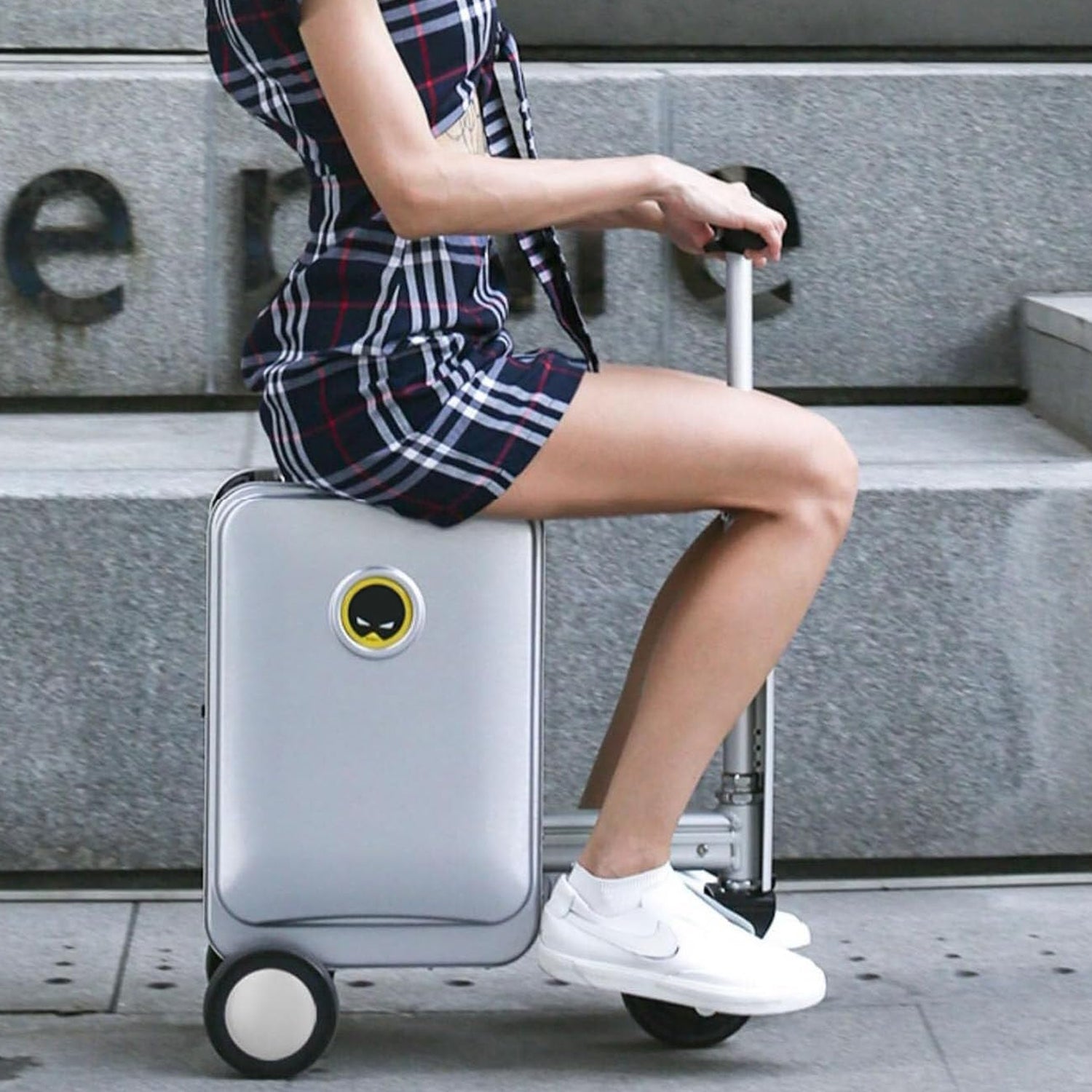 Wukusy electric travel suitcase with built-in scooter, removable battery, sleek design, and adjustable speed for smart luggage travel.