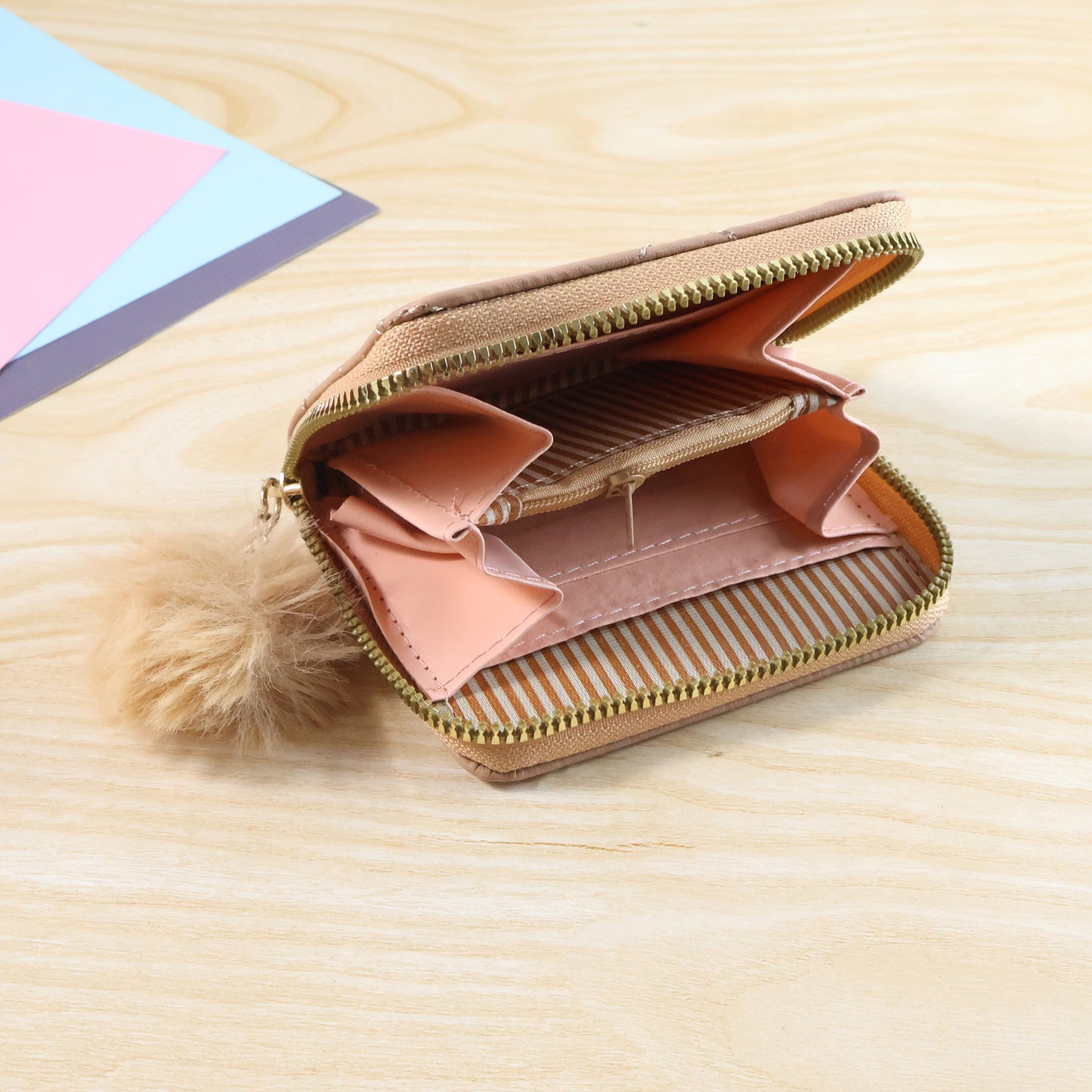 Wukusy stylish kids travel wallet with soft fur zip puller, featuring colorful design and multiple compartments for small essentials.