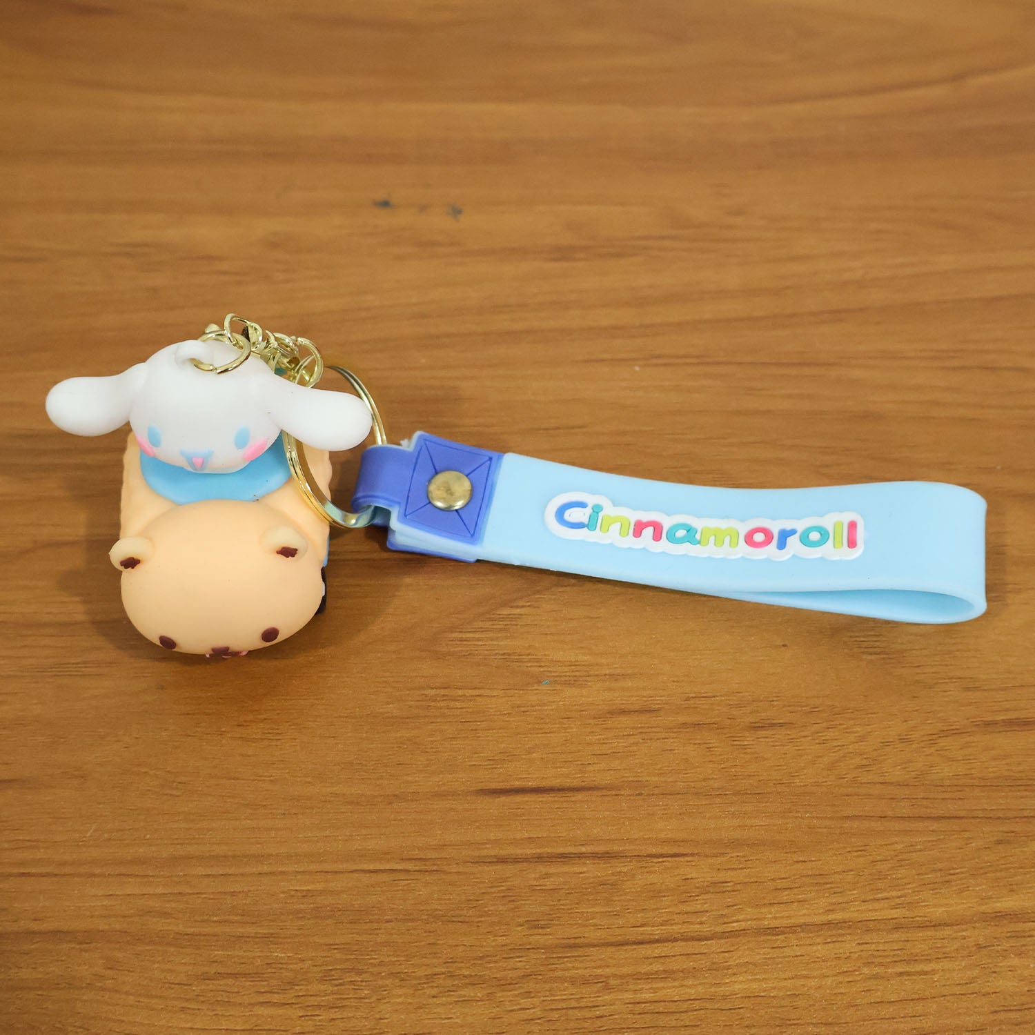 Cute cartoon dog character silicone keychain by Wukusy, featuring a colorful, playful dog design on a keyring.