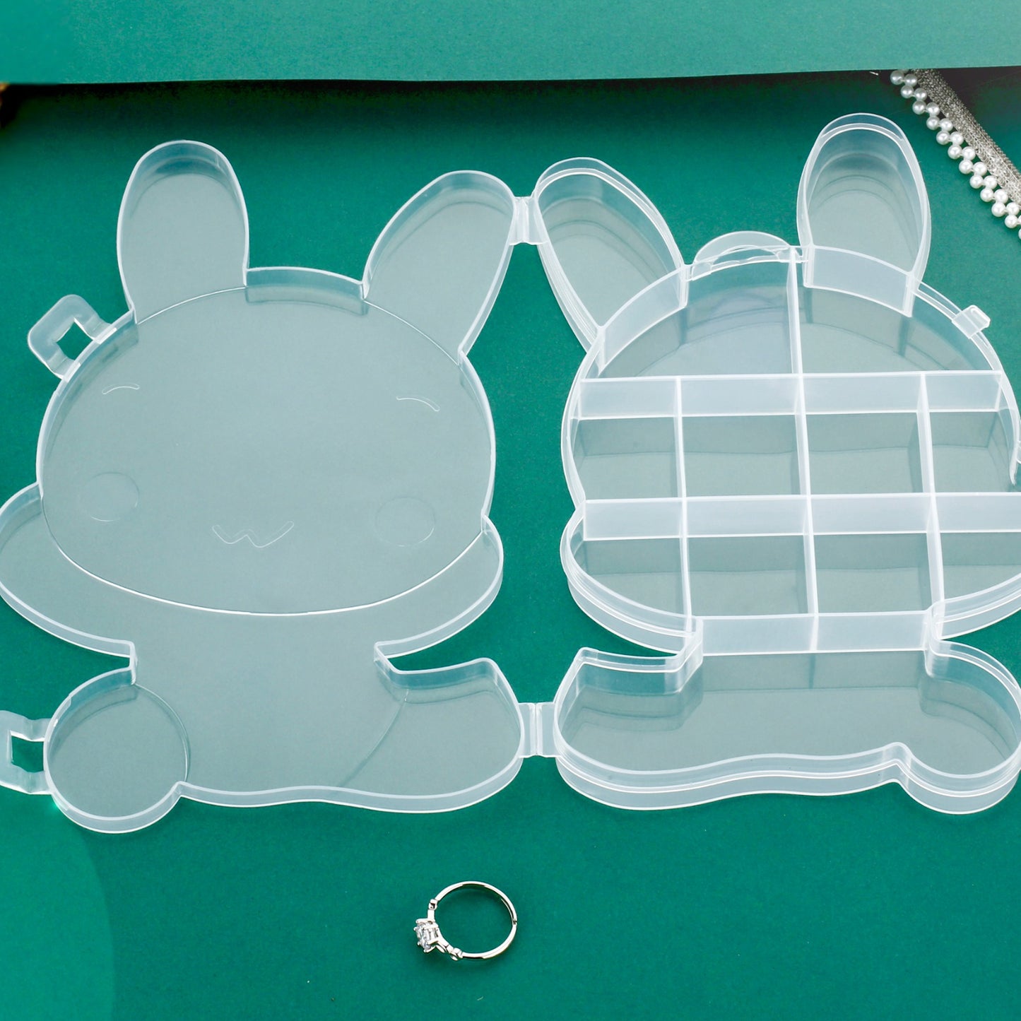 Clear plastic cartoon bear jewelry storage box with compartments, ideal for organizing small jewelry items and accessories.