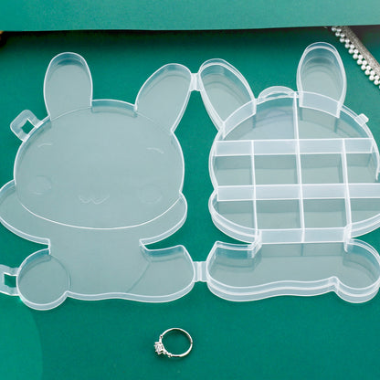 Clear plastic cartoon bear jewelry storage box with compartments, ideal for organizing small jewelry items and accessories.
