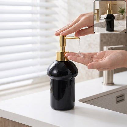 Black glass liquid soap dispenser bottle with gold pump from Wukusy, refillable and elegant for bathroom or kitchen use.