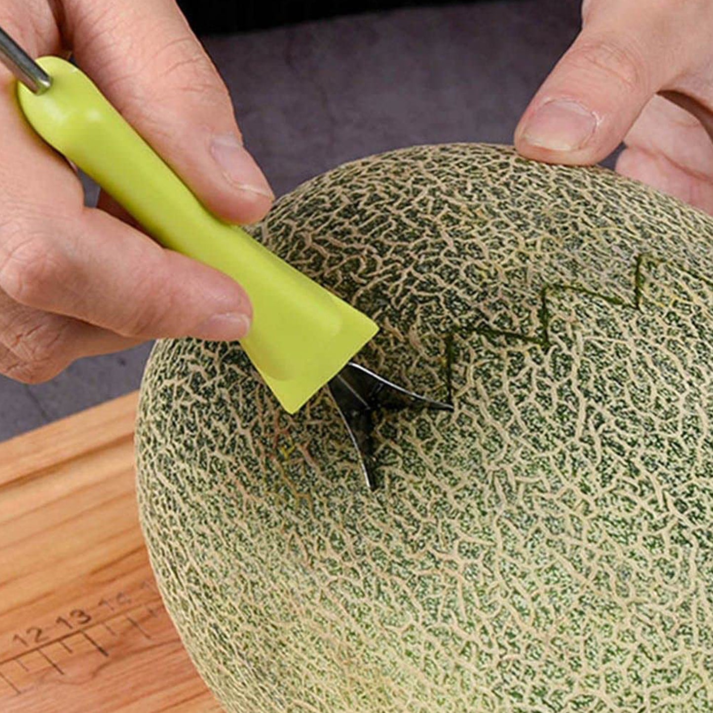 Wukusy 4-in-1 stainless steel melon baller and seed remover with double-sided scooper for fruit and dessert decoration.