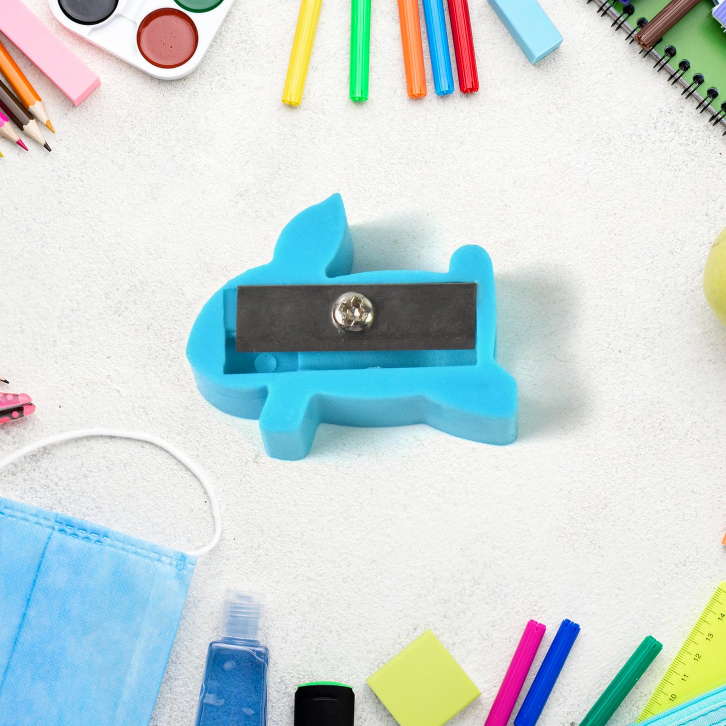 Small Wukusy plastic pencil sharpener with a cute, colorful design, ideal for office and school use.