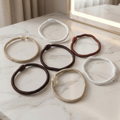 Set of 32 Wukusy soft elastic hair rubber bands in mixed colors, suitable for gentle hair styling and securing hair.