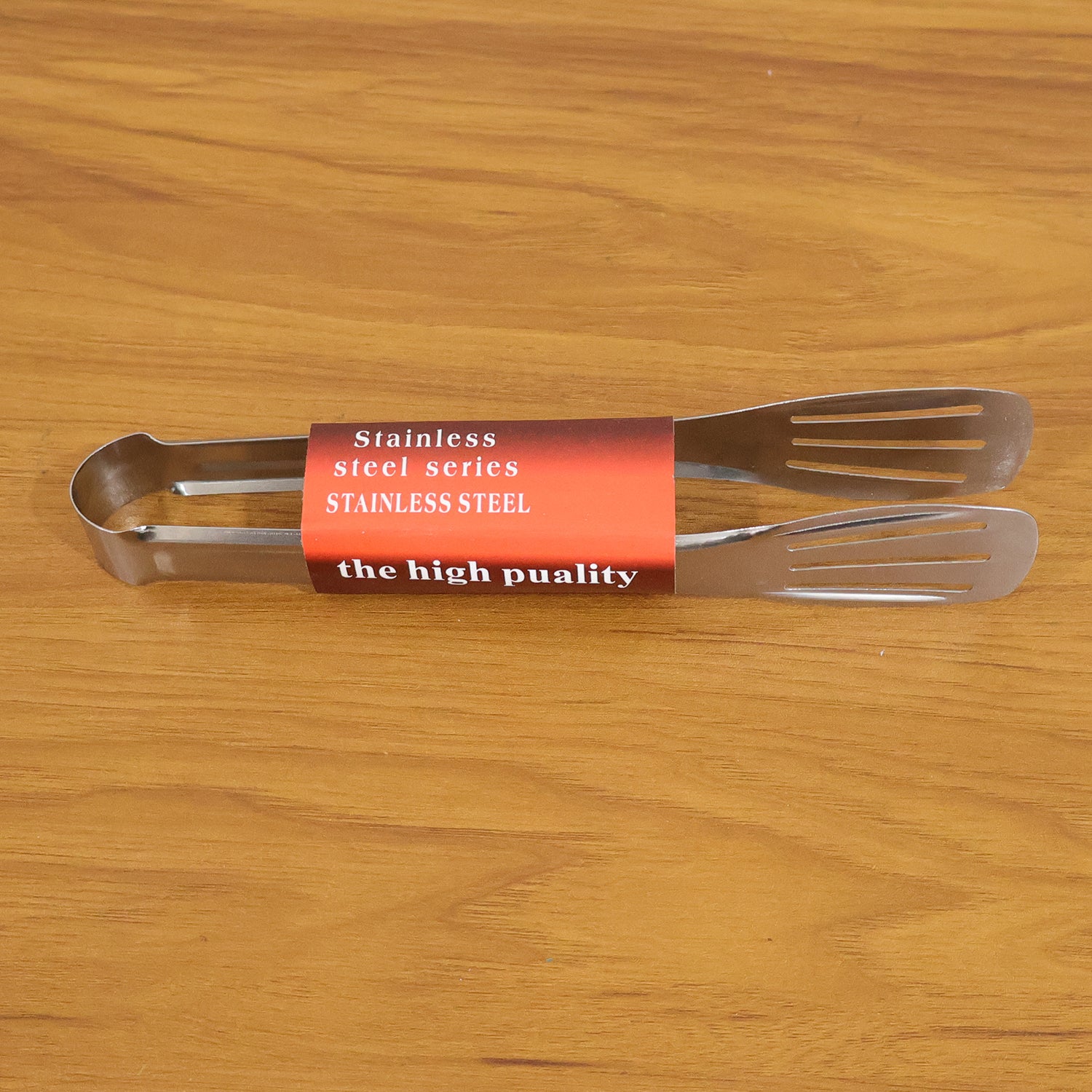 Stainless steel kitchen serving tongs by Wukusy, 1 piece, with a shiny finish and ergonomic handle for easy food serving.