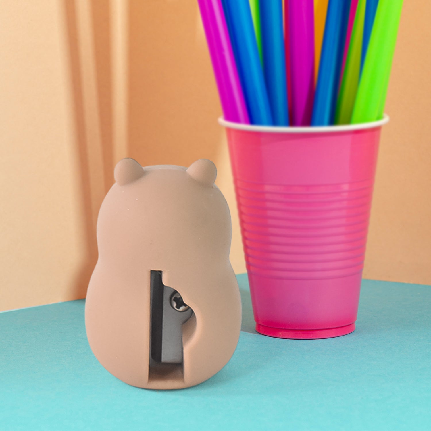 Wukusy cartoon shape pencil sharpener with built-in eraser, colorful office accessory for kids and students.