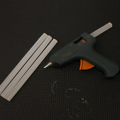 Wukusy hot melt glue sticks for glue gun, 20 cm long, suitable for home improvement projects, shown in a close-up image.