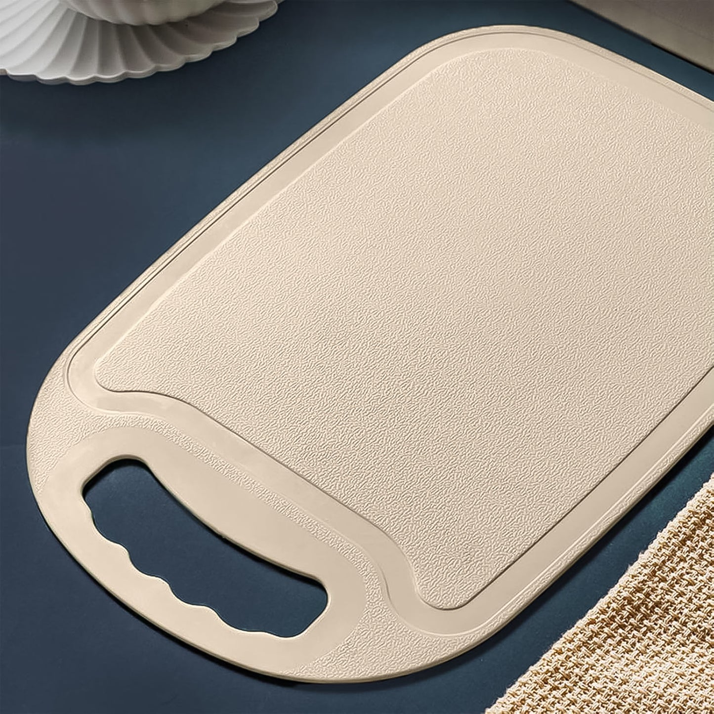 Wukusy durable plastic chopping board, 34x23 cm, suitable for home kitchen use, shown with clean surface and textured edges.