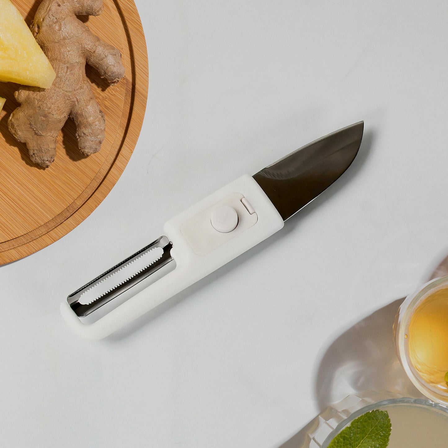 Wukusy multifunctional peeler and fruit knife with sawtooth edge for peeling apples, carrots, potatoes, and slicing fruits and vegetables.