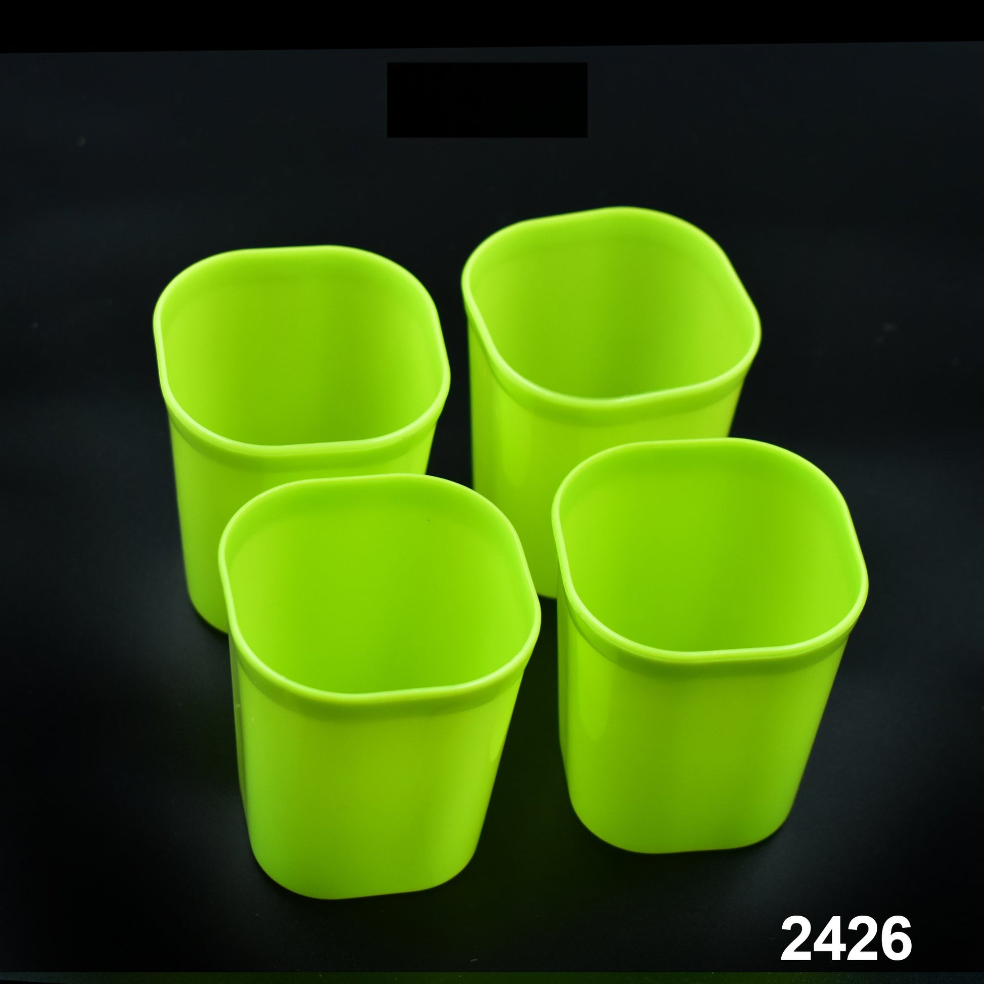 Set of four Wukusy plastic drinking glasses for milk, water, and juice, ideal for home and kitchen use.