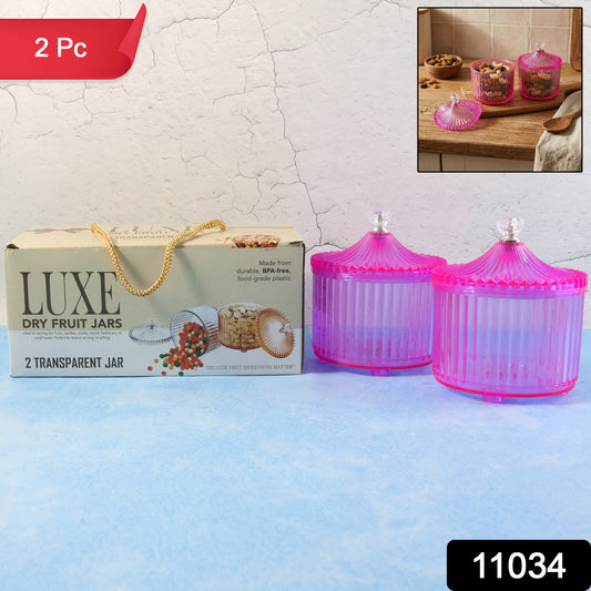 Two transparent plastic luxury dry fruit storage jars from Wukusy, featuring clear lids and spacious design for kitchen organization.