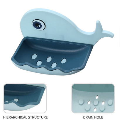 Fish-shaped waterproof soap dish holder by Wukusy, wall-mounted and adhesive, shown in a bathroom setting with two soap dishes.