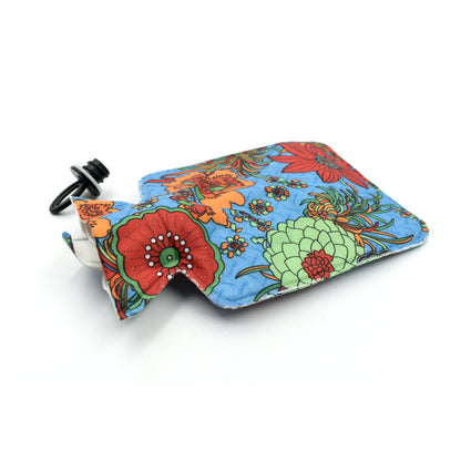 Wukusy 7254 personal care rubber hot water heating pad for pain relief, showing the flexible, textured heating pad in a relaxed position