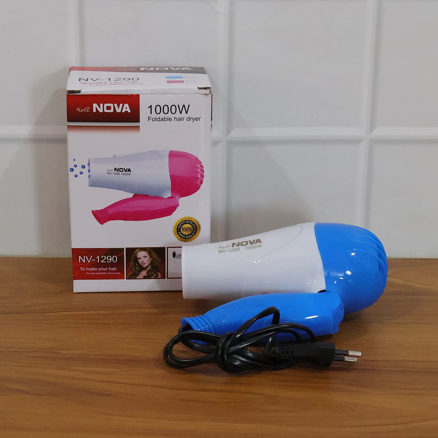 Wukusy foldable 1000W hair dryer with dual speed settings, compact and portable for easy styling and travel.