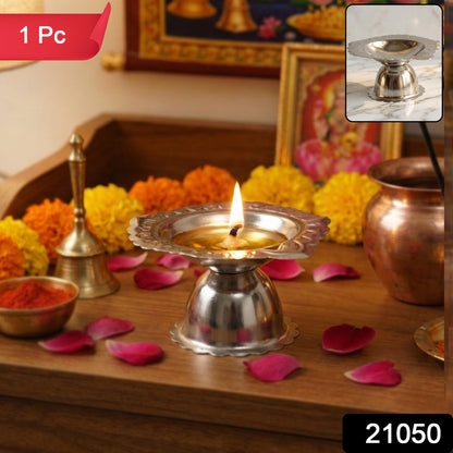 Stainless steel traditional Puja diya stand with multiple holders for oil lamps, designed for religious ceremonies.