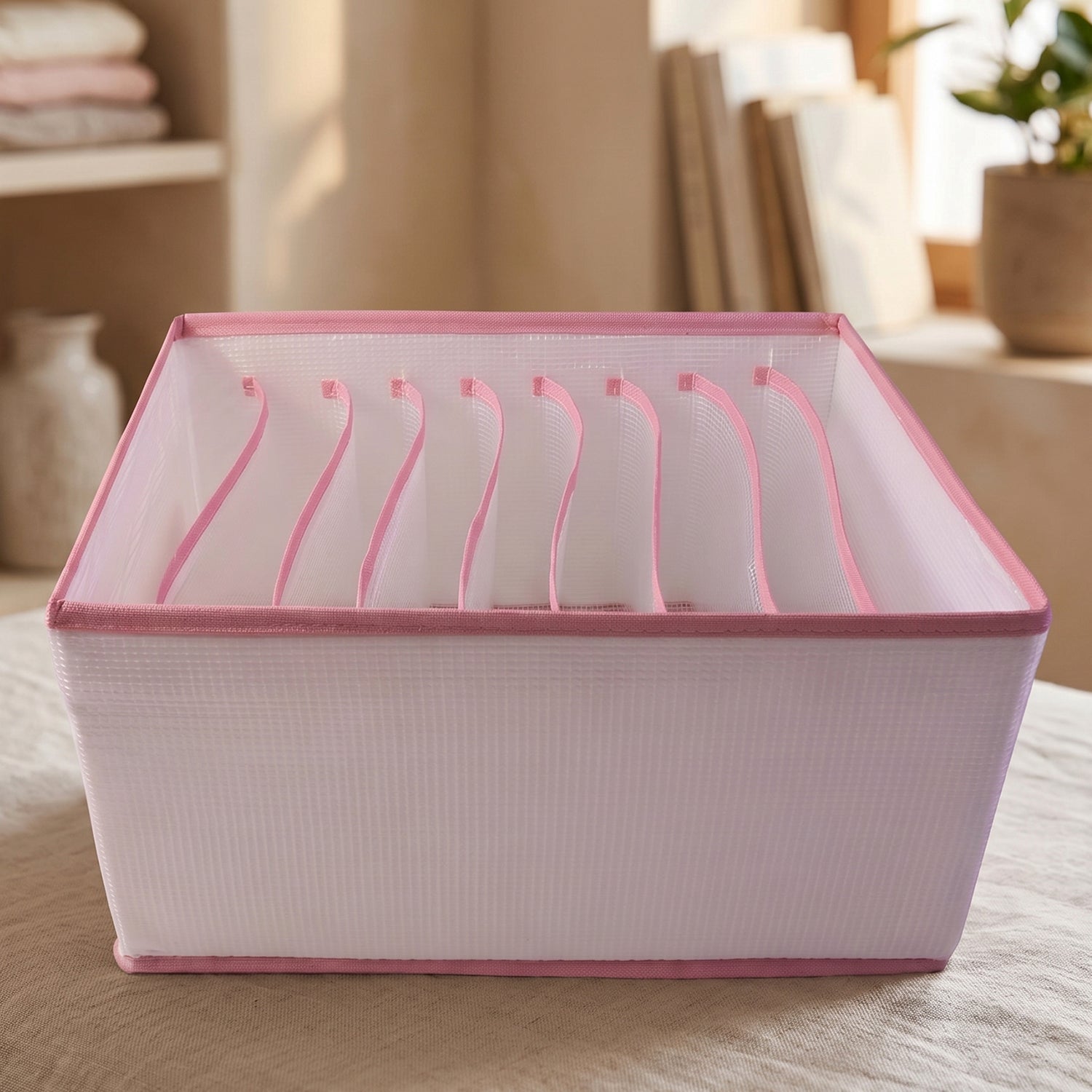 Wukusy 9-section foldable clothes organizer for wardrobe drawer storage, suitable for jeans and folded clothing.