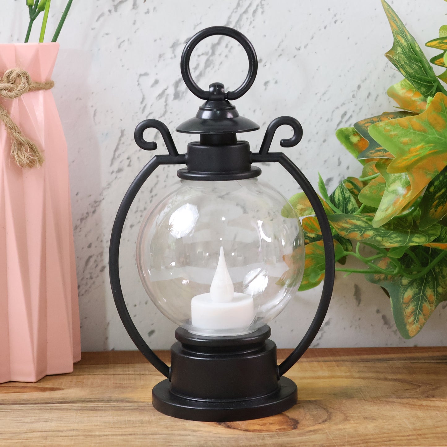 Wukusy LED Storm Lantern decorative light with metal handle and glass enclosure, outdoor-ready lighting for ambiance and decoration.