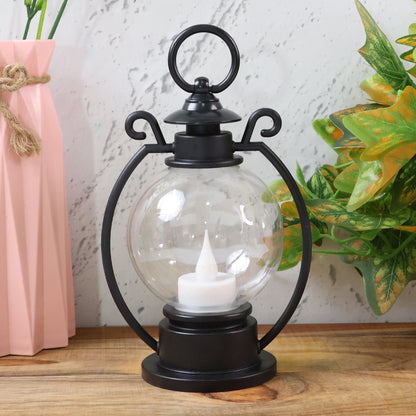 Wukusy LED Storm Lantern decorative light with metal handle and glass enclosure, outdoor-ready lighting for ambiance and decoration.