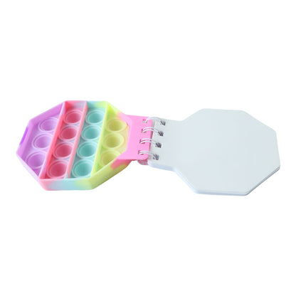 Wukusy Push Bubble Pop It Fidget Diary with pastel hexagon cover, kids' notebook featuring bubble pop sensory toy design.