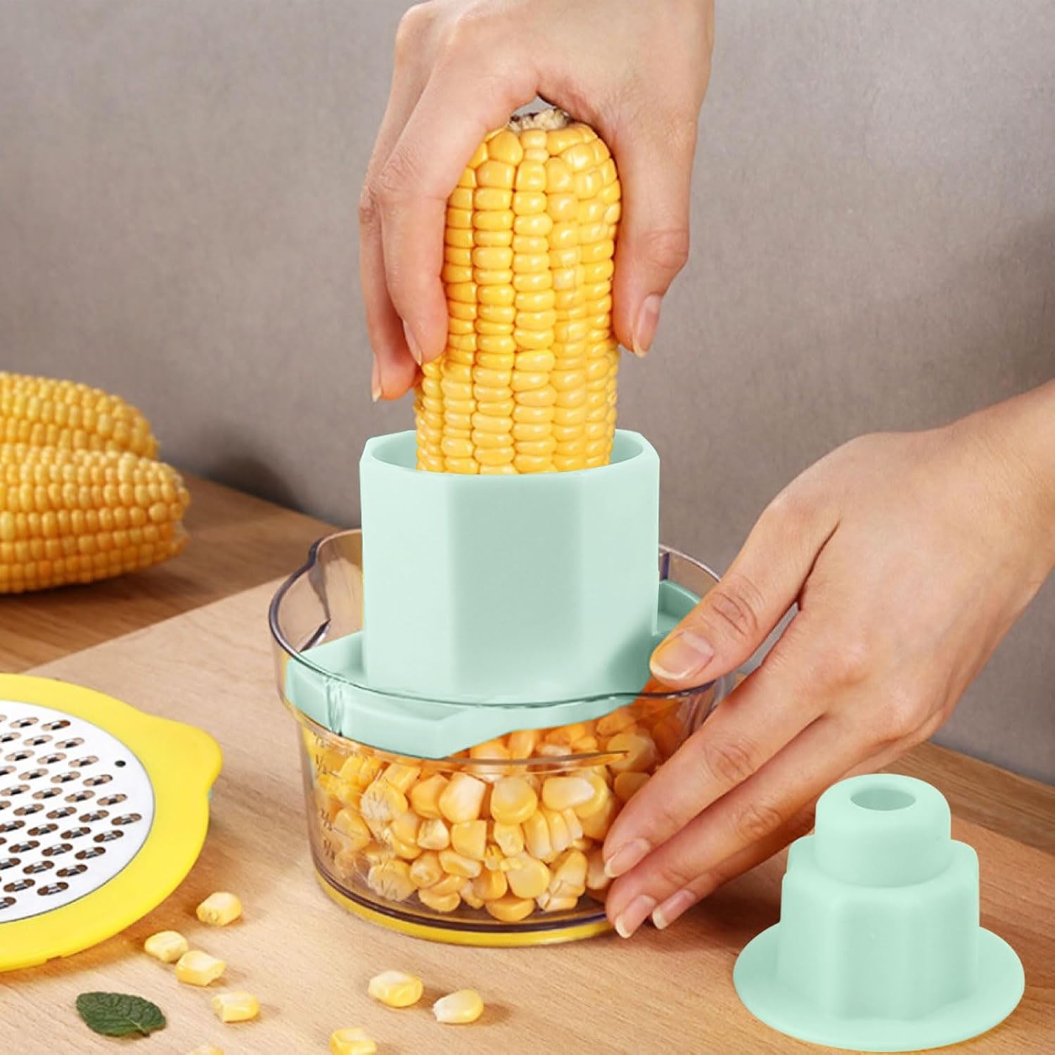 Wukusy multipurpose manual vegetable grater and corn kernel stripper with stainless steel blades on a white background.