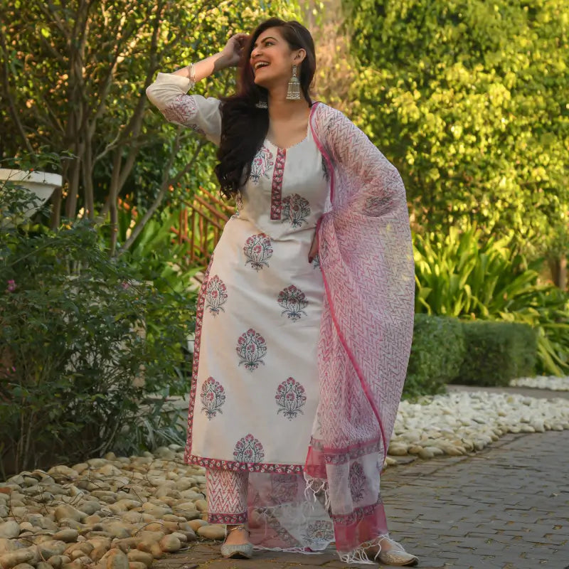 White printed cotton kurta and pant set for women, featuring a comfortable and stylish traditional outfit with floral design.