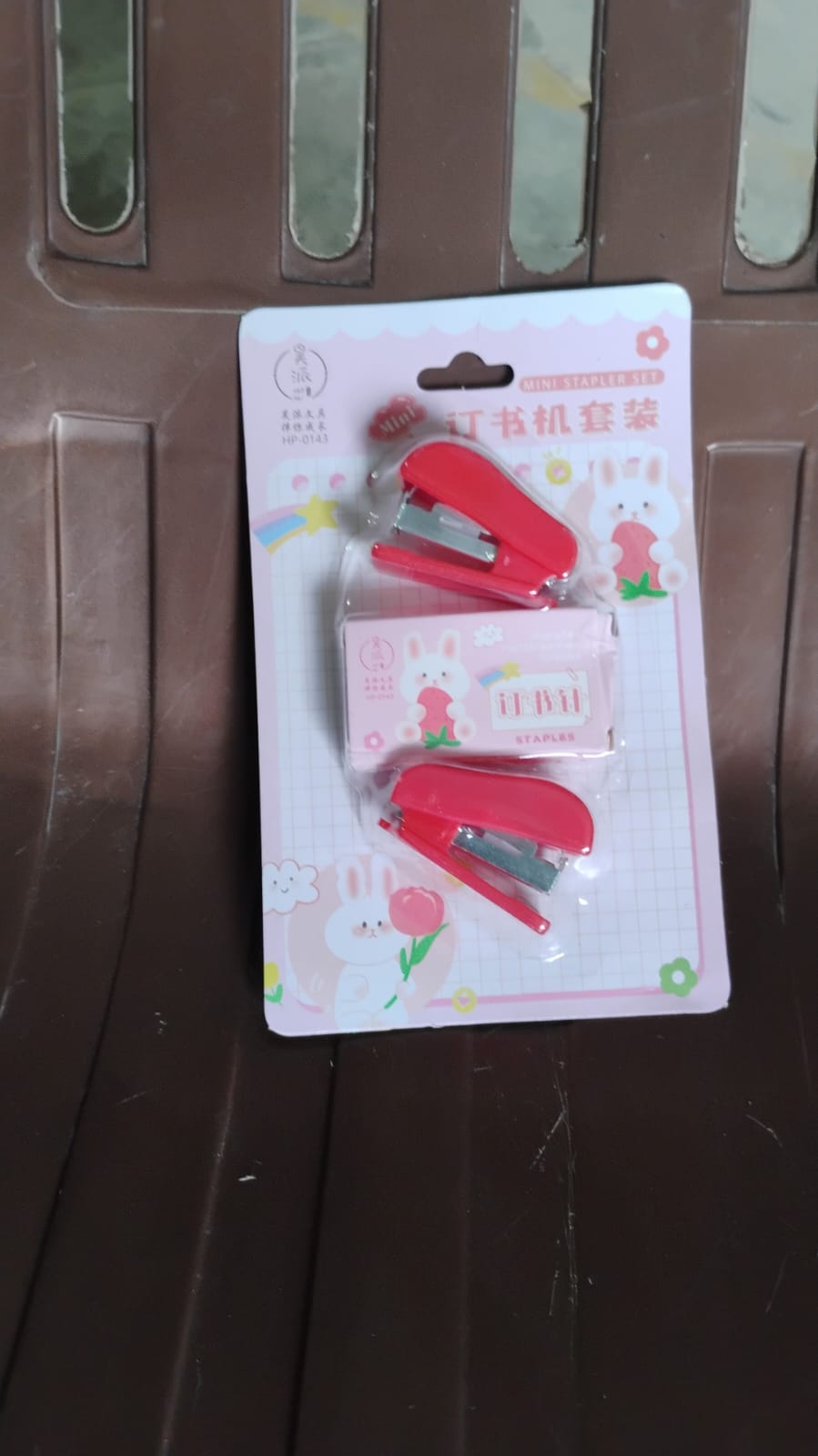 Wukusy mini office stapler with staples and pin set, compact and portable for quick paper fastening.