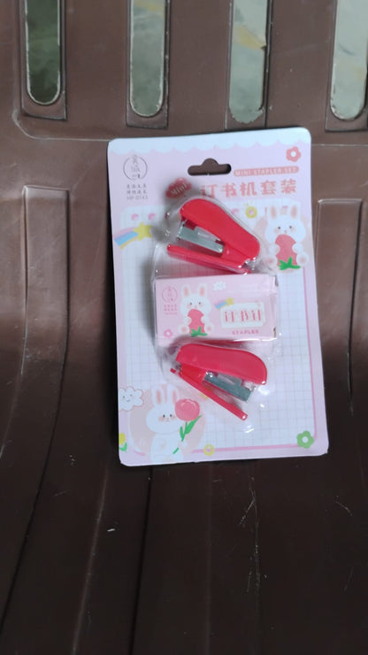Wukusy mini office stapler with staples and pin set, compact and portable for quick paper fastening.
