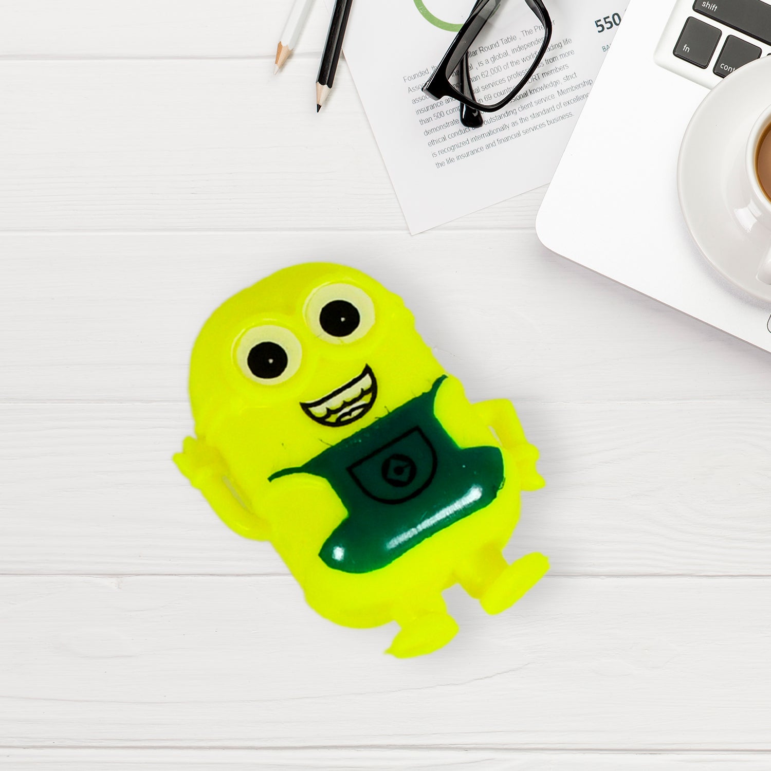 Small green Minion toy by Wukusy, cute and miniature Minion character perfect for kids' play and collection.