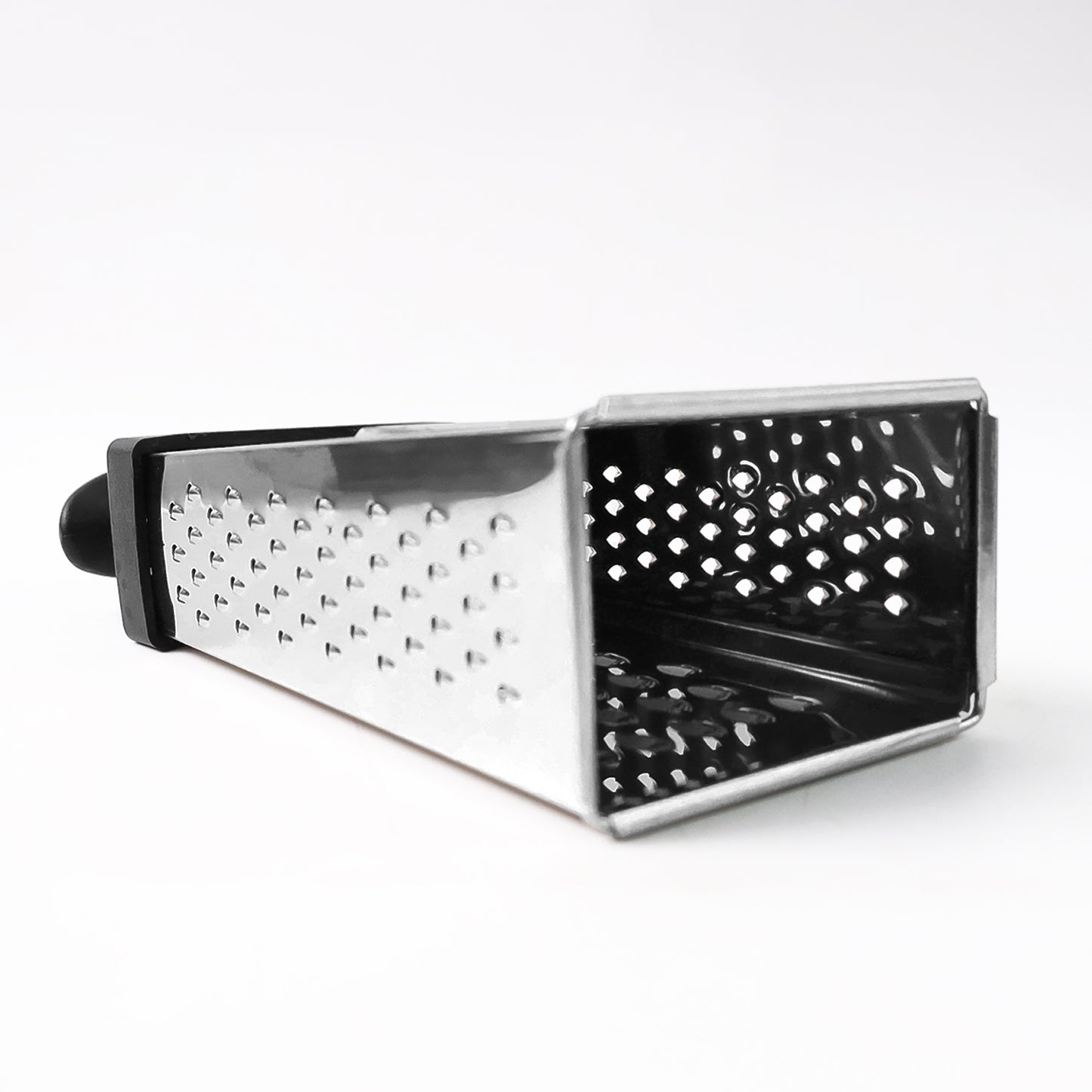 Wukusy Apex Classic 4-in-1 stainless steel grater with handle for slicing, shredding, and grating in the kitchen.