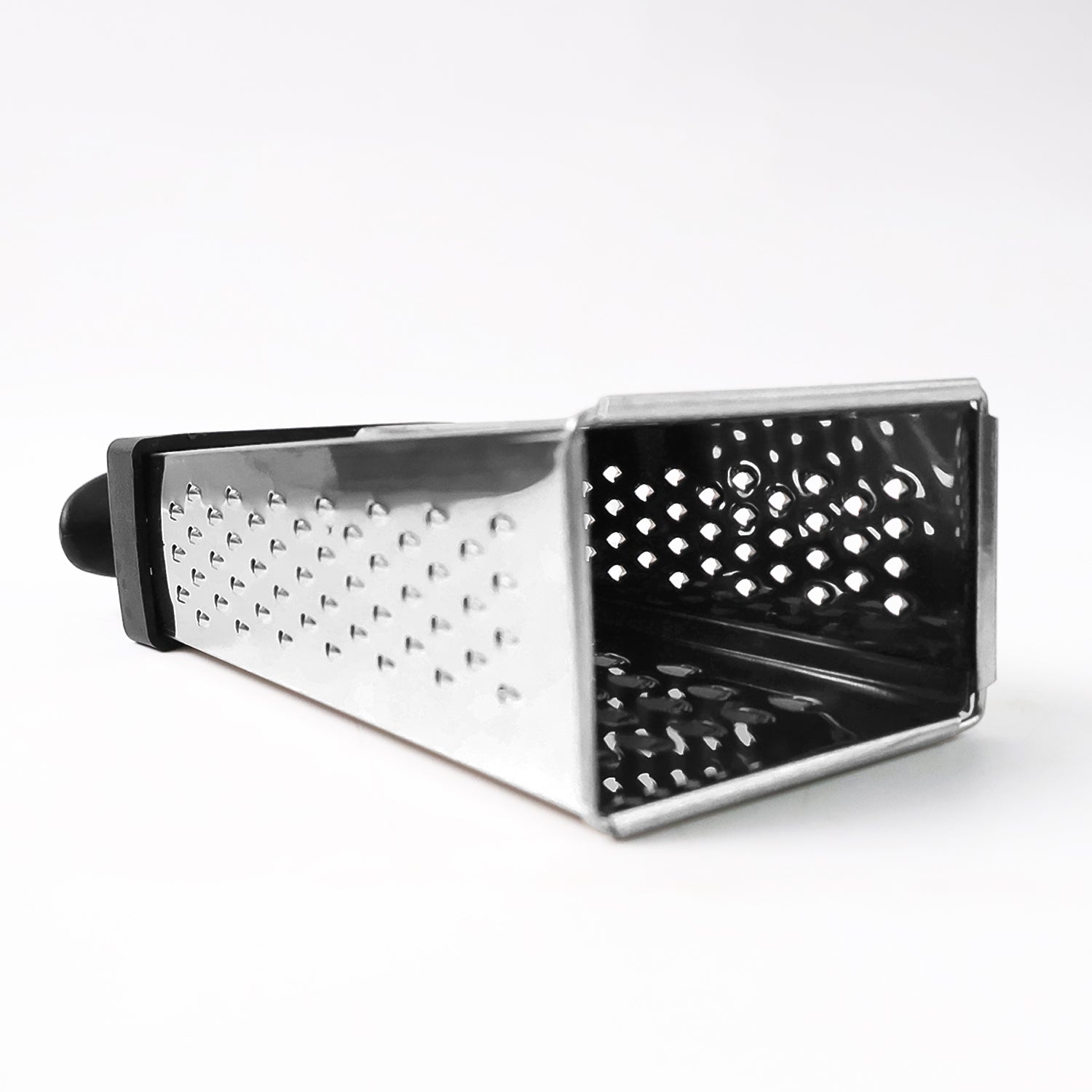 Wukusy Apex Classic 4-in-1 stainless steel grater with handle for slicing, shredding, and grating in the kitchen.