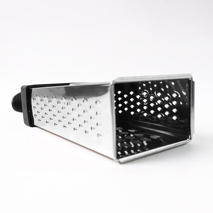 Wukusy Apex Classic 4-in-1 stainless steel grater with handle for slicing, shredding, and grating in the kitchen.