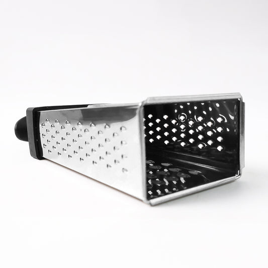 Wukusy Apex Classic 4-in-1 stainless steel grater with handle for slicing, shredding, and grating in the kitchen.