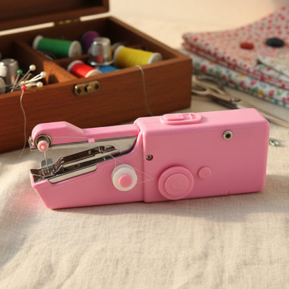 Portable handheld sewing machine by Wukusy, compact device with built-in spool and control buttons for quick sewing repairs.