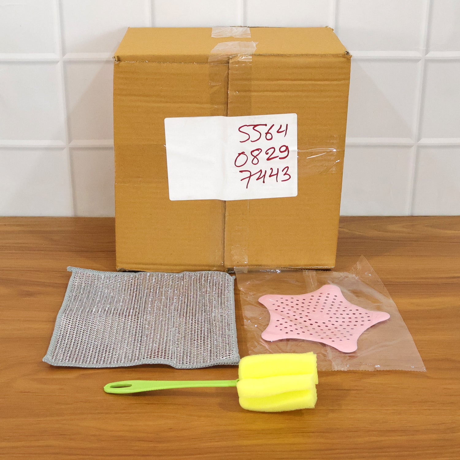 Wukusy 3-in-1 kitchen cleaning combo set with scrub brushes, sponges, and cleaning cloths on a countertop.