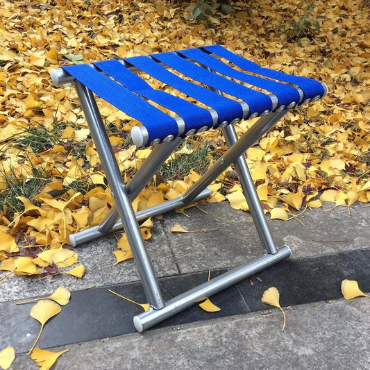 Wukusy 8804 folding beach stool, portable outdoor travel chair with compact design for camping, fishing, hiking, and picnics.