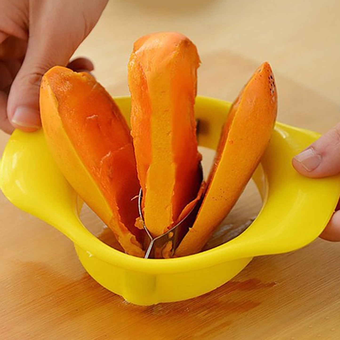 Wukusy Mango Cutter Chopper with stainless steel blades for slicing and preparing mangoes efficiently in the kitchen.