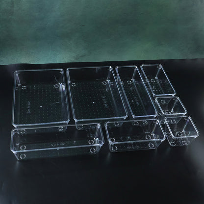 Wukusy 8-in-1 drawer organizer storage tray set with multiple compartments for kitchen or office organization.