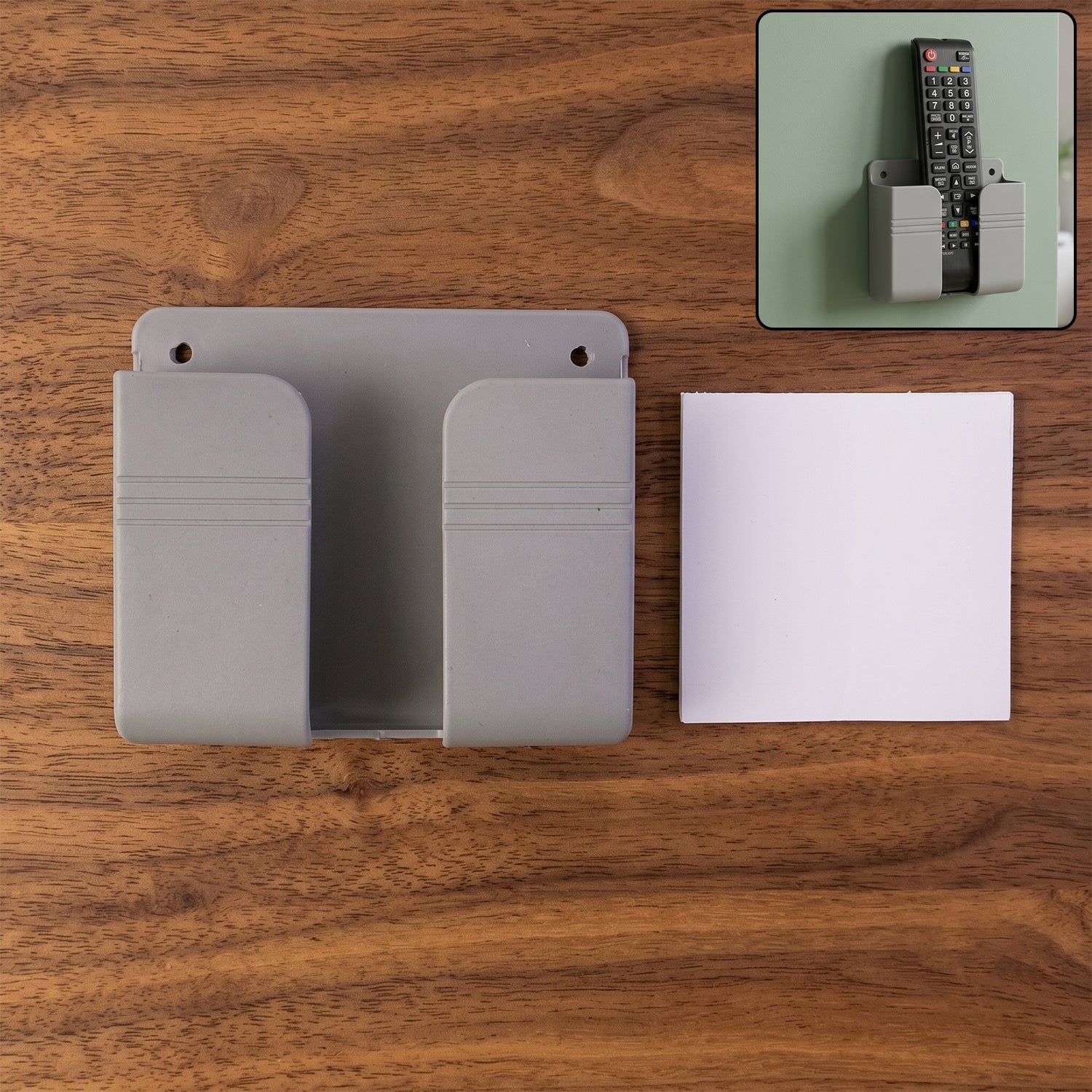 Wall-mounted Wukusy mobile remote holder, space-saving organizer with multiple slots for remote and device storage.