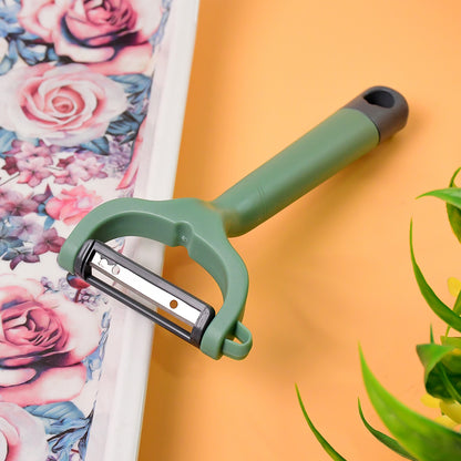 Wukusy Apex Premium ergonomic vegetable and fruit peeler with stainless steel blade on a white background.